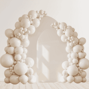 The Double Panel Balloon Arch with Backdrop, featuring clusters of white balloon decor, stands in a bright room with light wood flooring—ideal for adding style to any corporate event in Los Angeles.