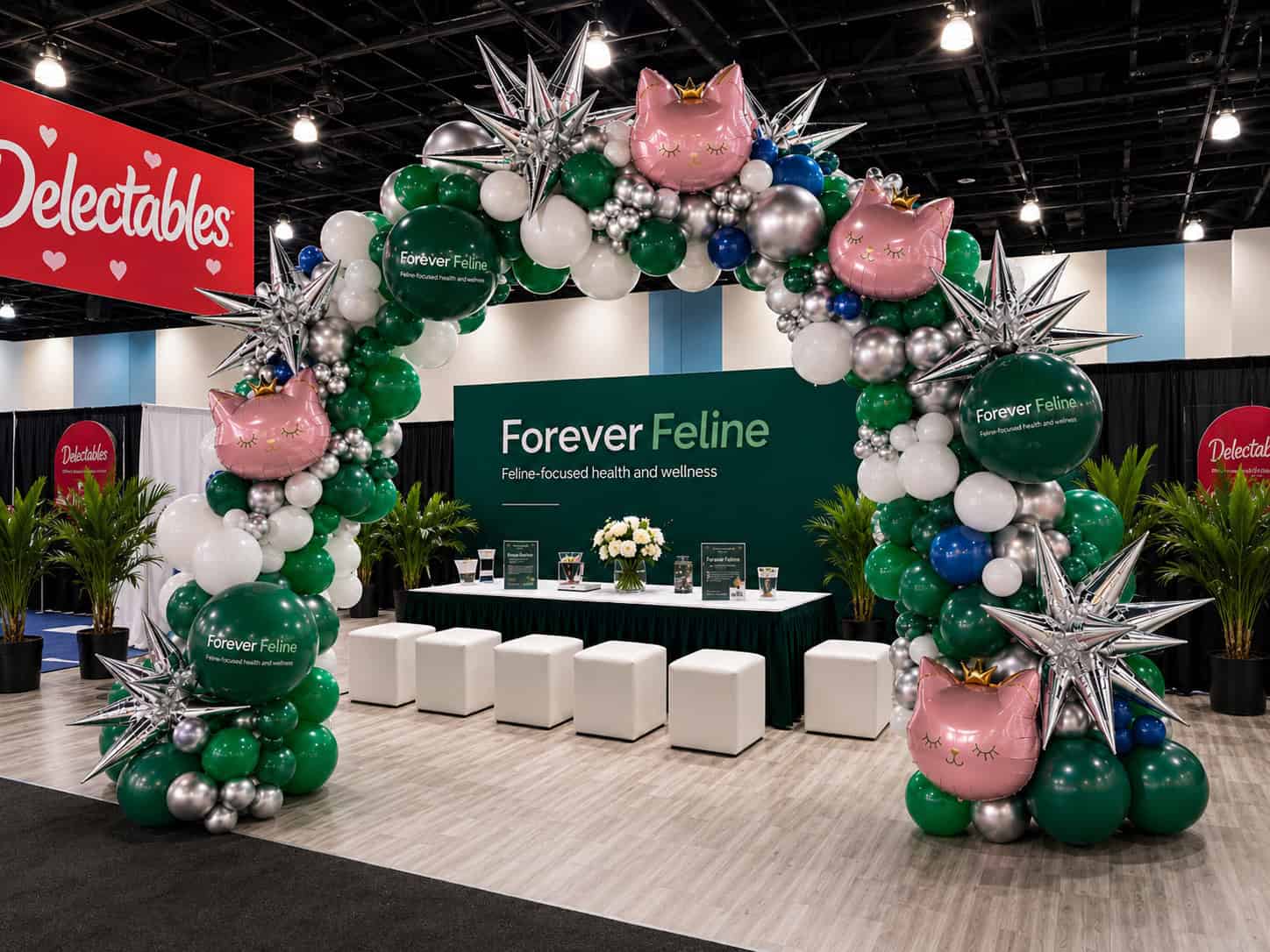 Balloon arch with cat and star shapes decorates a "Forever Feline" booth focused on feline health and wellness, making it a standout feature for corporate events or business events at an indoor convention or expo.