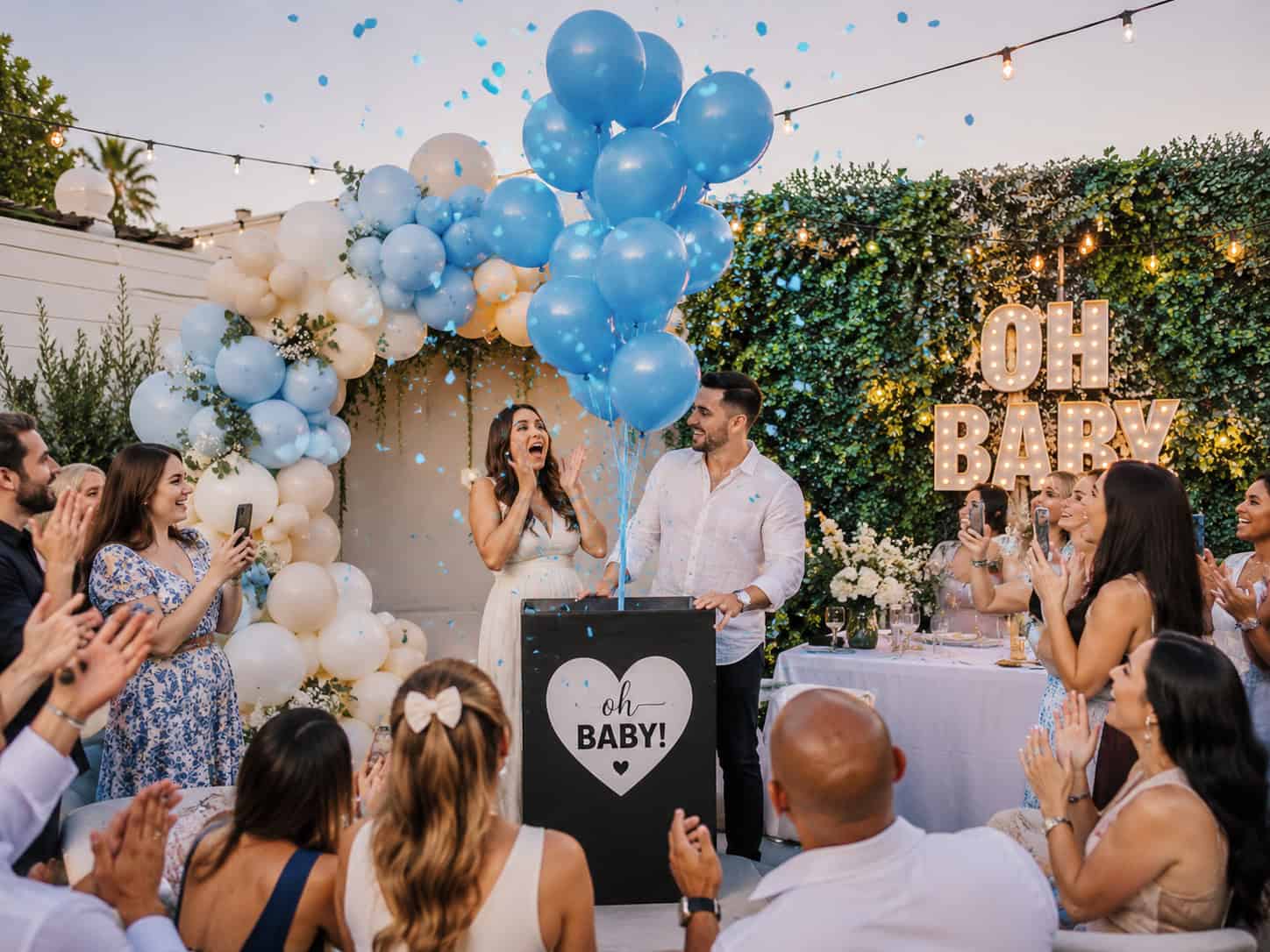 gender reveal party with surprise balloons